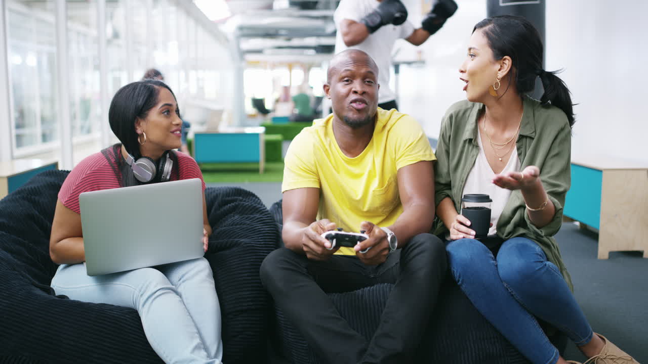 Office Break: Colleagues Gaming and Relaxing