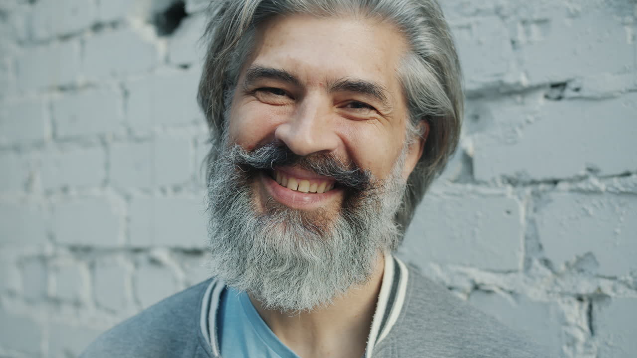 Smiling older man with a beard