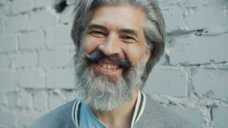 smiling older man with a beard