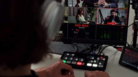 person operating a video switcher for live production or broadcasting