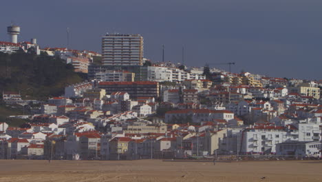 town buildings by the beach at nazare, portugal