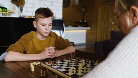 caucasian man and boy in the living room