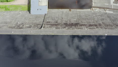 an aerial, close overhead view of loch cluanie and cluanie dam