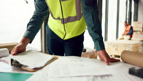 hands of architect check blueprint at construction