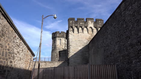 long shot of medieval style wall, towers and parapet at eastern state penitentiary