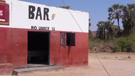 establishing shot of a bar in a small african village in namibia