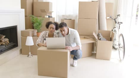 young black couple moving into their new home