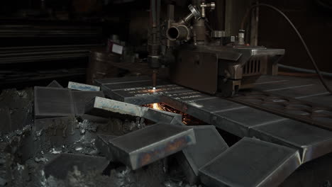 a plasma cutter cuts metal in an industrial company - high energy through heat and electrical power - special tools in the metal industry - sparks and fire in high resolution 4k shot
