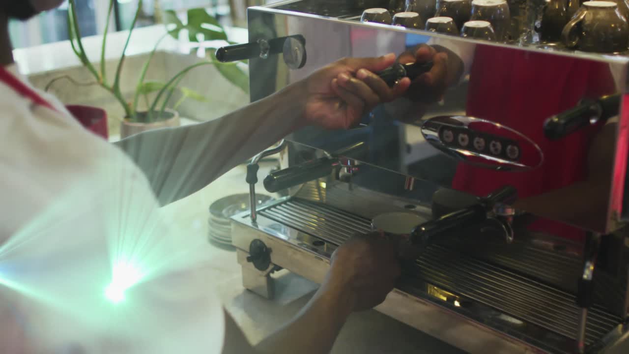Animation of light spots over biracial man preparing coffee in cafe
