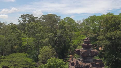 wide shot of an ancient temple rising out of the jungle