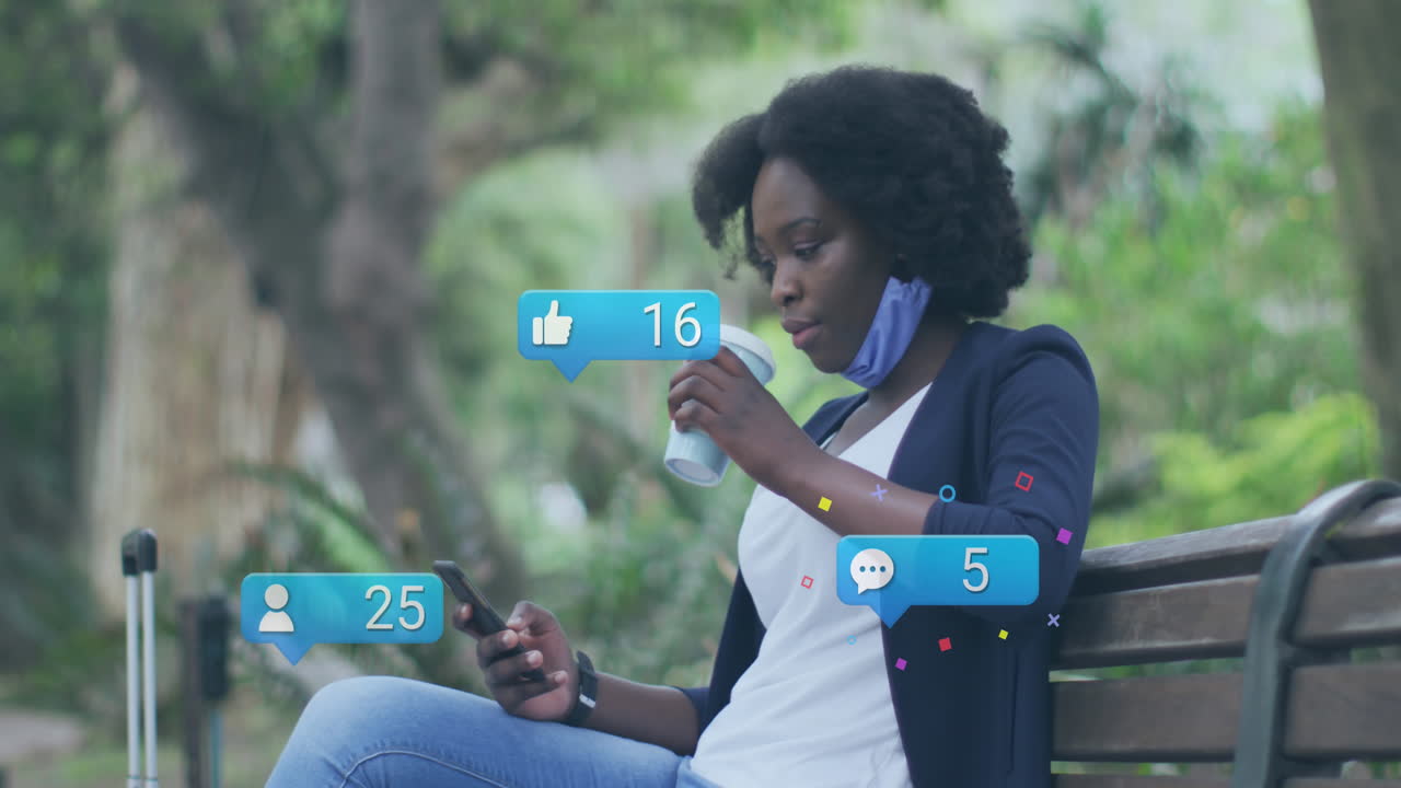 Animation of social media icons and data over african american woman using smartphone