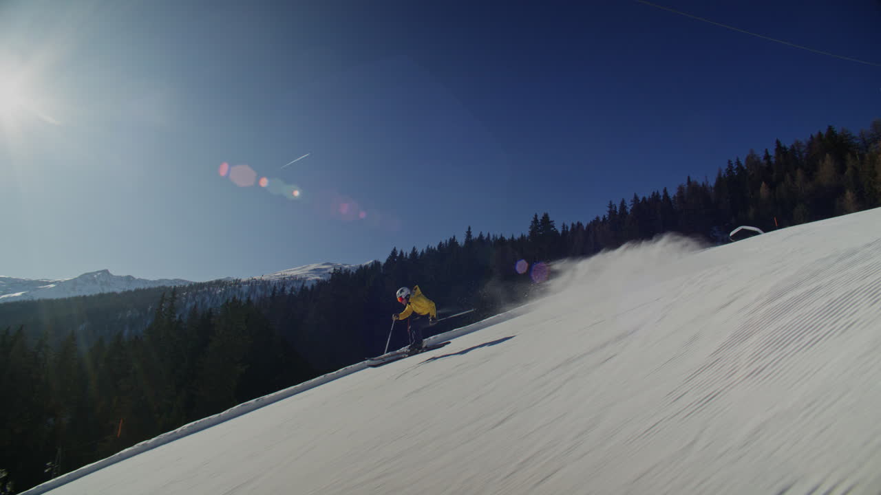 High performance alpine ski carving on groomed pistes in Verbier Bruson and Val de Bagnes filmed with drone and follow cam on a bluebird winter day showcasing fast dynamic fun skiing