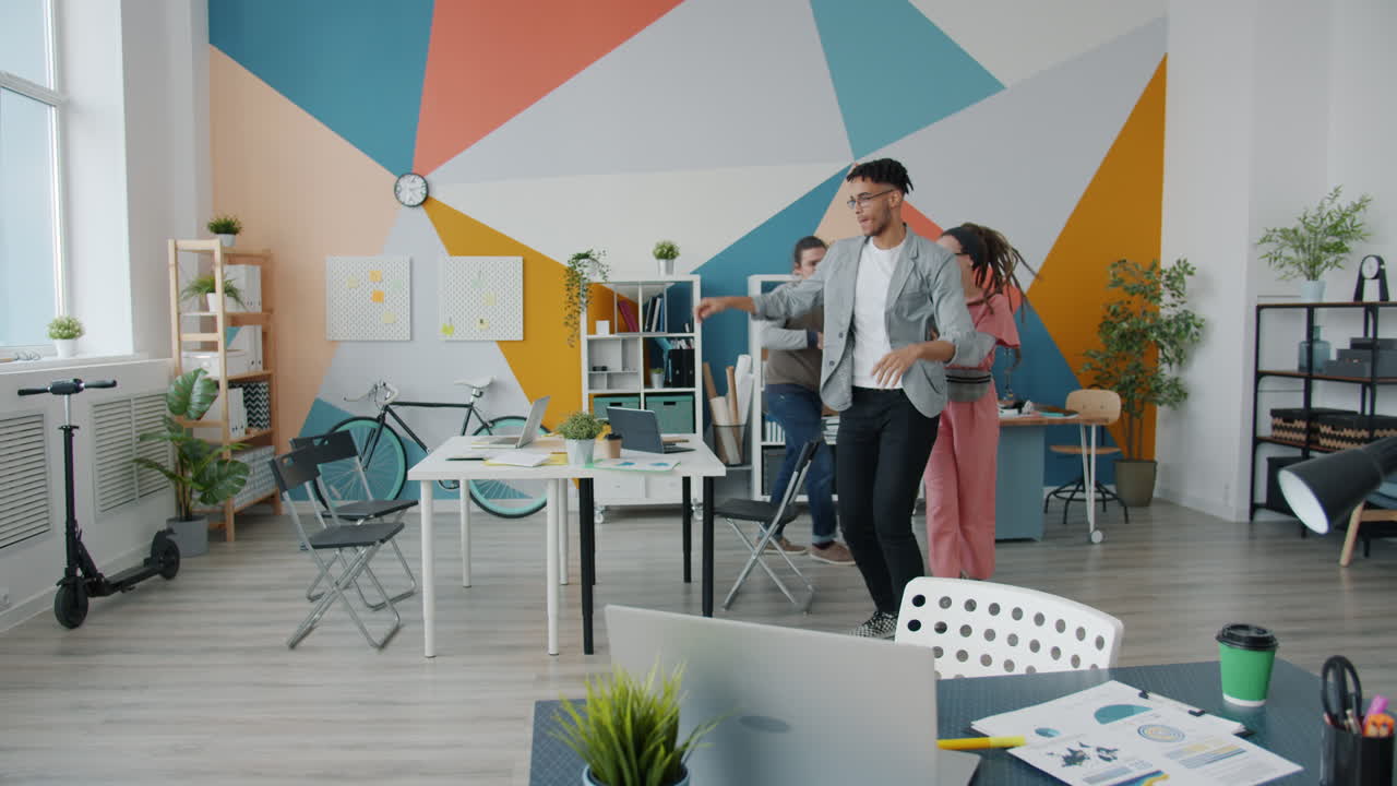 Happy Team Dancing in a Modern Office