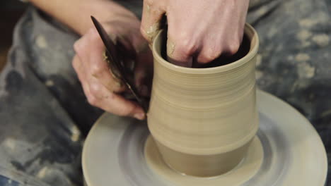 The-hands-of-a-potter-make-a-jug-on-a-potter's-wheel-2