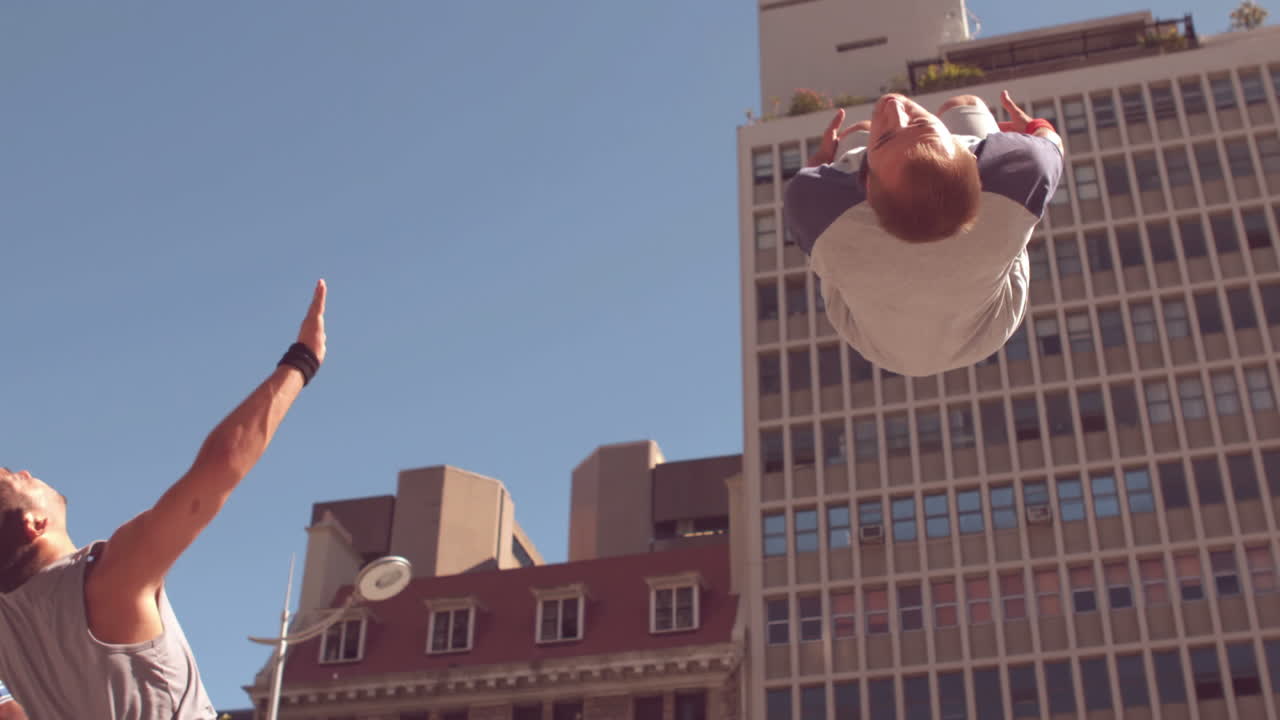 Friends doing somersault