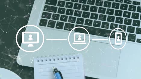 animation of flow chart of icon and connected dots over laptop, notepad and coffee cup on table