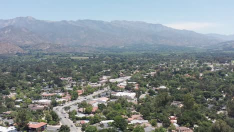 Super-wide-descending-aerial-shot-of-charming-downtown-Ojai,-California