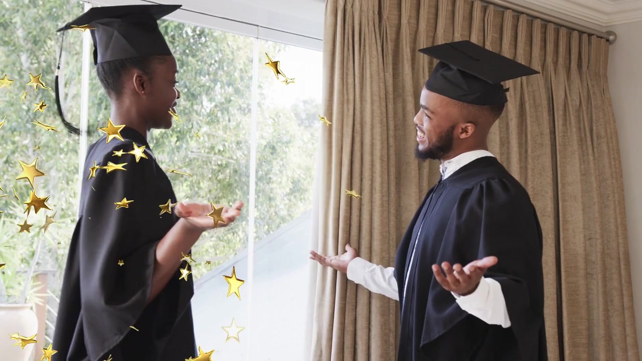 Male graduate raising hands, adjusting cap and gown by window for graduation, gold-star drifting