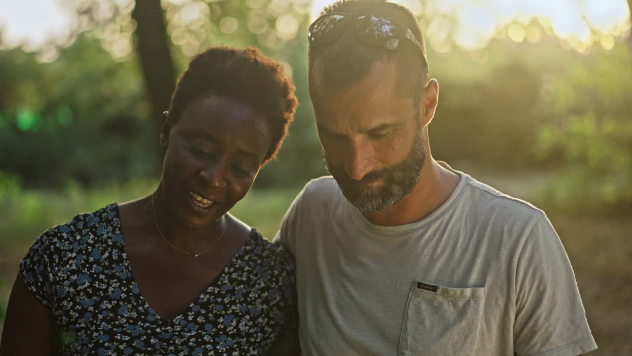A couple enjoying a sunset outdoors