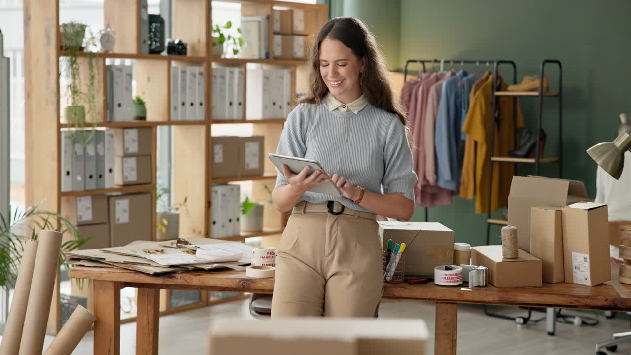 Woman using tablet to manage her small business
