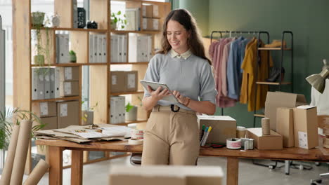 woman using tablet to manage her small business