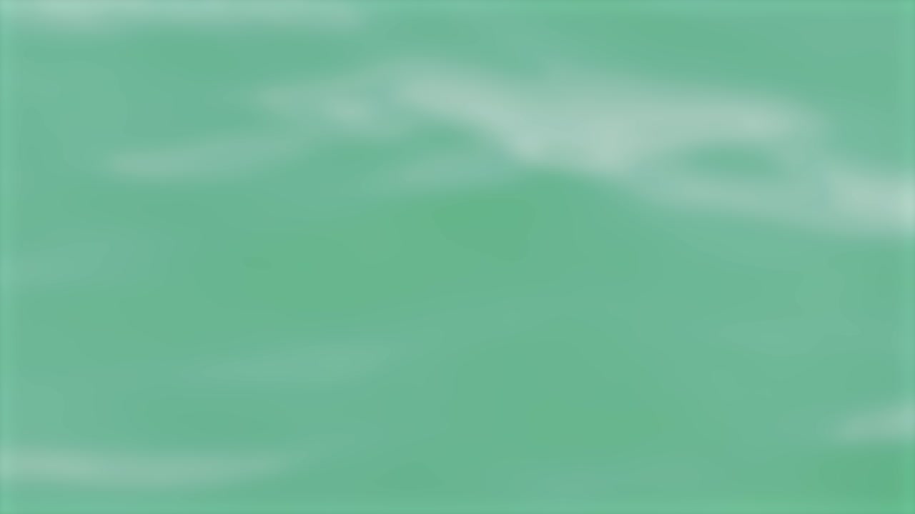 Soft, blurred waves move across a turquoise ocean surface in Phuket, Thailand, creating a serene and calming atmosphere