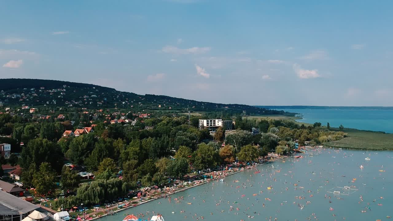 Drone footage at Alsóörs (Balaton lake) of the lake itself, boats, and the beautiful nature.