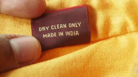 close-up of a clothing tag with care instructions