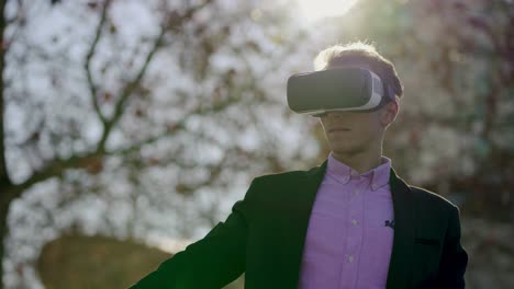 young man using vr headset outdoor