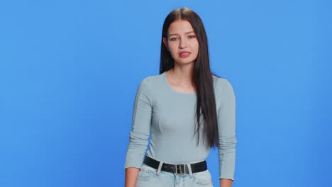 caucasian young woman shakes finger and saying no be careful avoid danger mistake disapproval sign