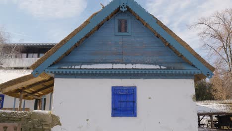 old house with blue windows and roof from 19th century