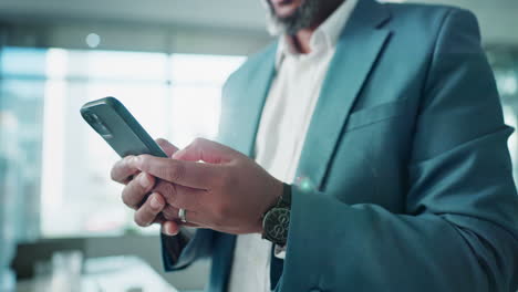 man using smartphone in business setting