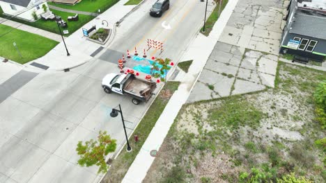 A-mural-in-progress-on-the-crosswalk-of-a-street