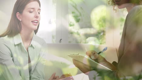 animation of plants over caucasian woman consulting psychologist