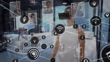 Animation of network of connections with icons over businesswoman wearing vr headset