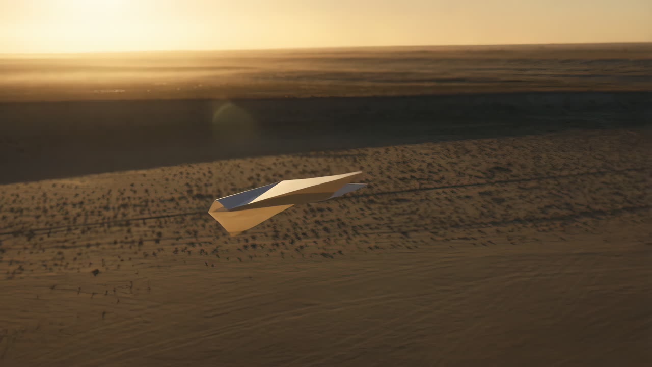 Paper Airplane Soaring Over Desert Landscape at Sunset