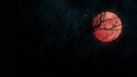 simulation of glowing red moon behind leafless tree branches