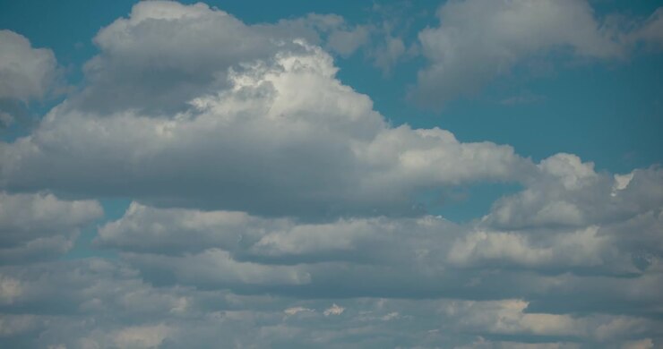 High dynamic range white clouds drifting timelapse, sunny day with blue sky