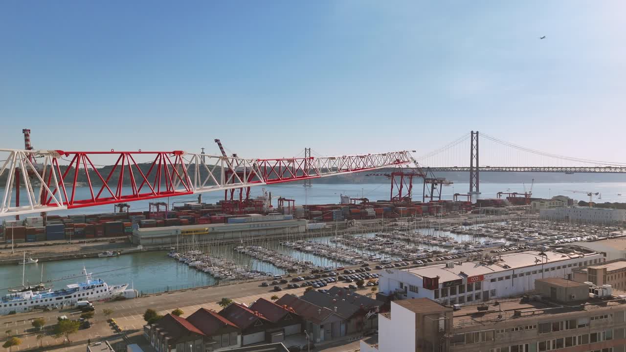 Aerial View of a Port with Cranes and Bridges