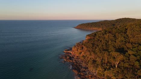 sunset over the edge of the beautiful noosa national park - sunshine coast queensland australia - aerial