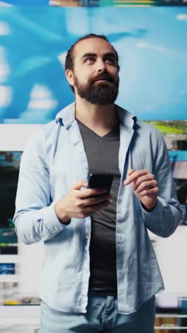 vertical video casual man texting on his phone and enjoying social media connection