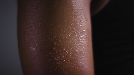 close up shot of beads of sweat on woman wearing gym fitness clothing exercising 4