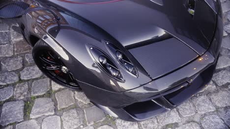 italian full carbon sport car front detail in the dark