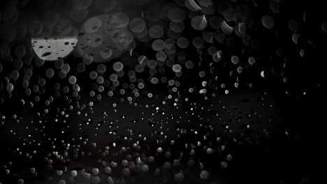 rain drops on a window at night