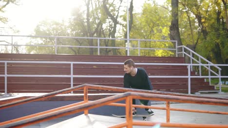 skateboarder skateboarding and jumping flip trick over the pipe and falling down on concrete street. skateboarder jumping