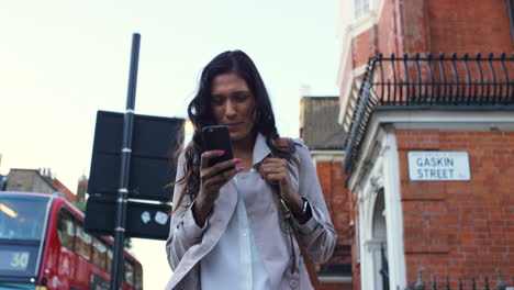 businesswoman using a smartphone in the city