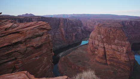 a gimbal pan of s curve bend in a river in a red rock canyon