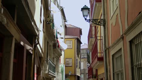 a handheld, stabilized shot of the buildings by the streets in porto, portugal