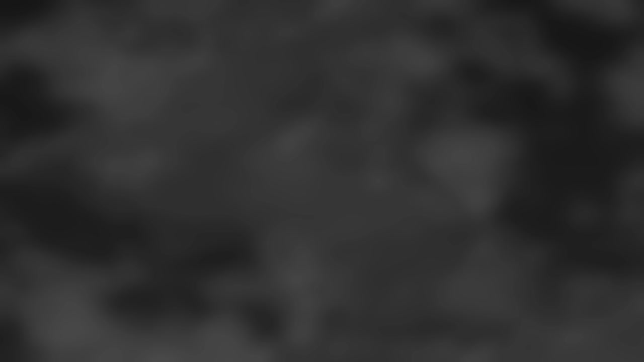 Subtle monochromatic dark clouds drift slowly across the screen in a seamless organic loop