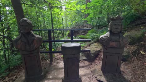 statues along a wooded trail in stirling